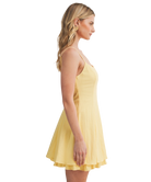 Woman wearing a yellow dress on a white background