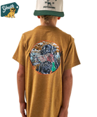 Person wearing a Light brown t-shirt with a colorful lab holding a duck graphic on the back, standing against a white background.