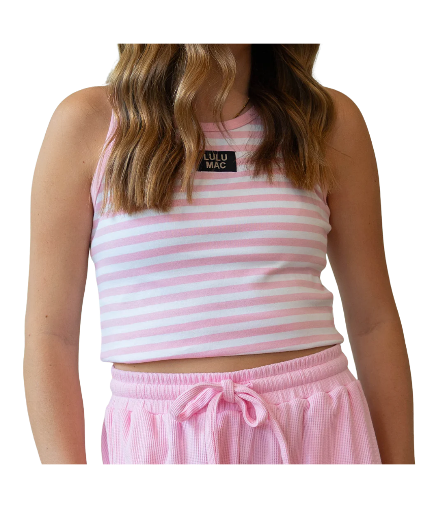 Person wearing a pink and white striped LULU MAC tank top with a visible brand logo on a white background