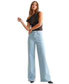 Woman wearring light denim pants with a high rise and wide leg