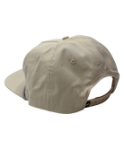 Beige cap with a zipper on the back against a white background