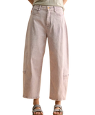 Light pink jeans worn by a person on a white background