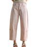 Light pink jeans worn by a person on a white background