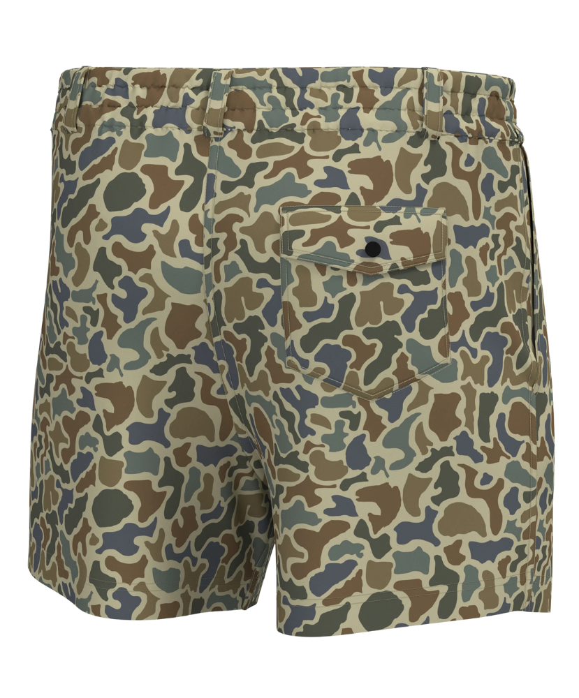 A pair of men's shorts featuring a classic camouflage pattern in shades of green, brown, beige, and gray. The back view shows a button closure on the back pocket and a side pocket on the right leg.
