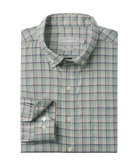 Folded plaid shirt with a visible brand label on a white background
