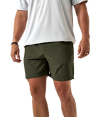 Person wearing green ATHLETIC shorts and a white t-shirt on a white background