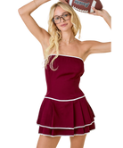 Woman in a maroon cheerleader outfit holding a football against a white background