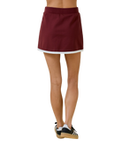 Maroon skirt worn by a person on a white background