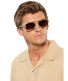 Krewe sunglasses with tortoiseshell frame and brown lenses on a white background