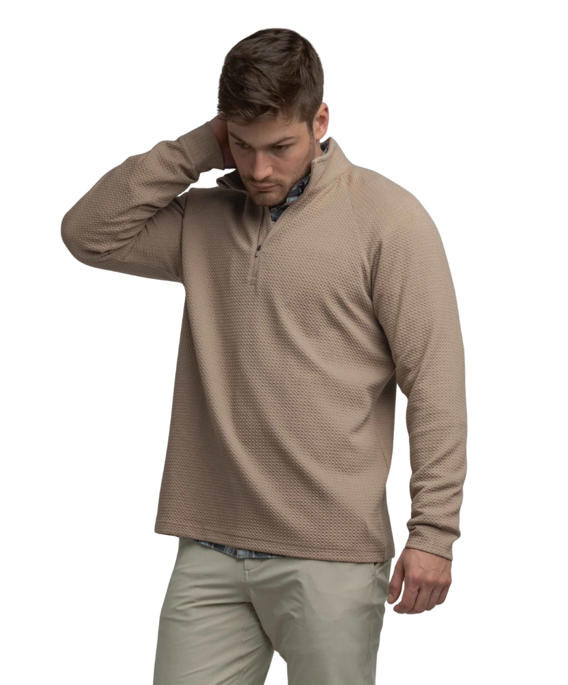 Man wearing a light brown long-sleeve quarter-zip pullover on a white background