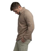 Man wearing a light brown long-sleeve quarter-zip pullover on a white background