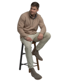 Man wearing a light brown long-sleeve quarter-zip pullover on a white background