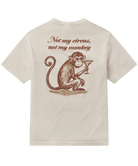 Beige t-shirt with a graphic of a monkey holding a martini glass and text 'Not my circus, not my monkey' on the back.