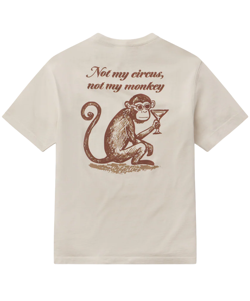 Beige t-shirt with a graphic of a monkey holding a martini glass and text 'Not my circus, not my monkey' on the back.