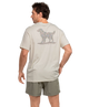 Man wearing a IVORY t-shirt with a CAMO dog graphic on the back, standing against a white background