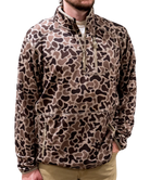 Leopard print pullover worn by a person on a white background