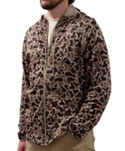Person wearing a leopard print jacket on a white background