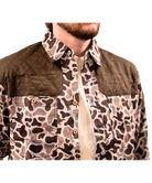 Camouflage-patterned jacket with a brown collar on a white background