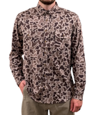 Camouflage patterned shirt worn by a person on a white background