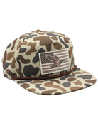 Camouflage-patterned cap with an American flag and mallard duck patch on a white background