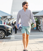 Navy and white seersucker striped Onward Reserve Drift shirt on a white background