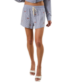 Person wearing blue checkered shorts on a white background