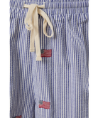 Blue and white striped shorts with American flag patches on a white background