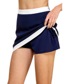 Navy blue skirt with white trim worn by a person on a white background