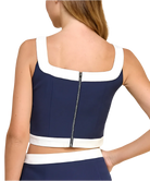 Navy and white crop top with zipper detail on a plain background