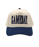 Beige and navy cap with 'GAMEDAY' text on a white background