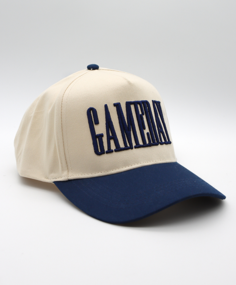 Beige and blue cap with 'Gamer' text on a white background