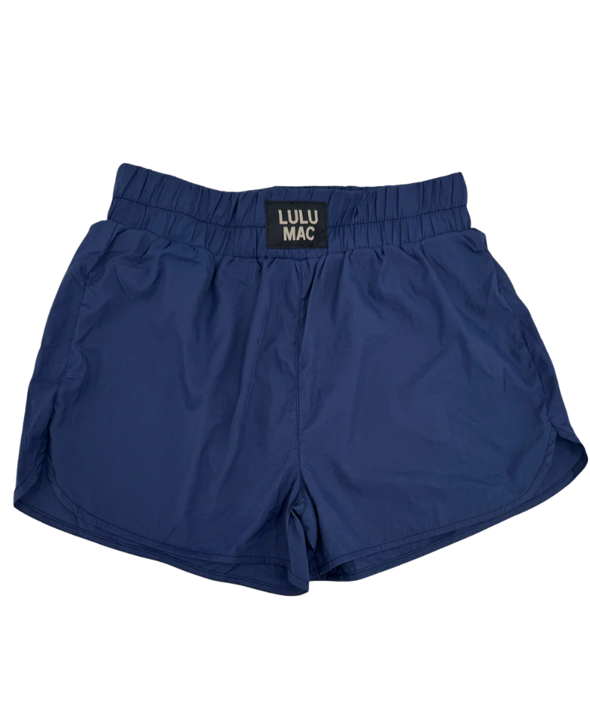 Blue shorts with a visible brand label on a white background