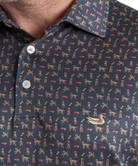 Close-up of a navy blue shirt with dog pattern