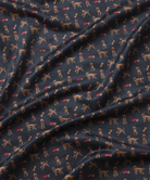Navy polo with a golden doodle pattern prnt