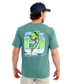 Man wearing a teal t-shirt with a MAHI MAHI fish graphic on a white background