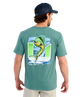 Man wearing a teal t-shirt with a MAHI MAHI fish graphic on a white background