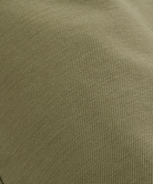 Close-up of a textured green fabric surface