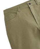 Close-up of olive green pants on a white background