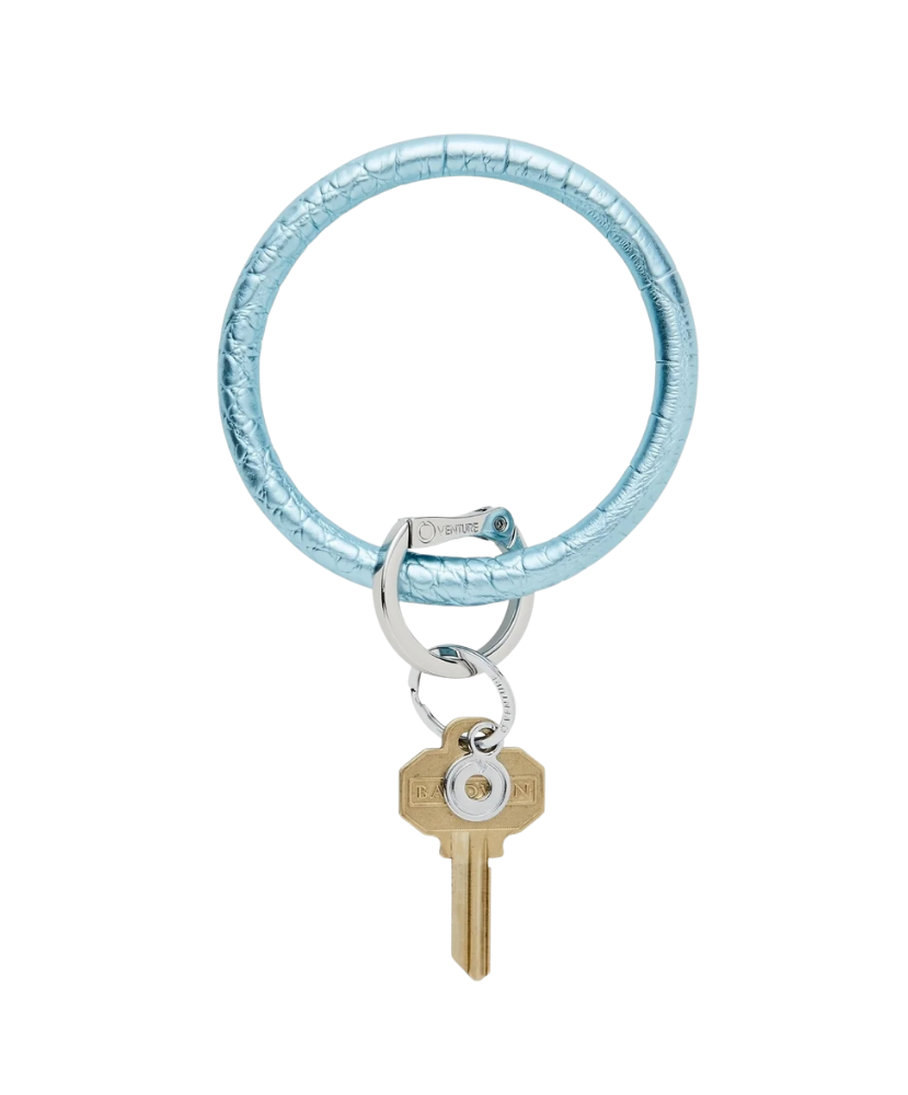 Blue keychain with a key on a white background