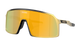 Fortnite shield-style sunglasses with a gold-framed metal structure and a large yellow-to-orange mirrored lens, shown on a plain white background.