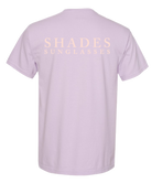 Lavender t-shirt with 'SHADES SUNGLASSES' text on a white background