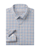 Folded checkered shirt with brand label on a white background