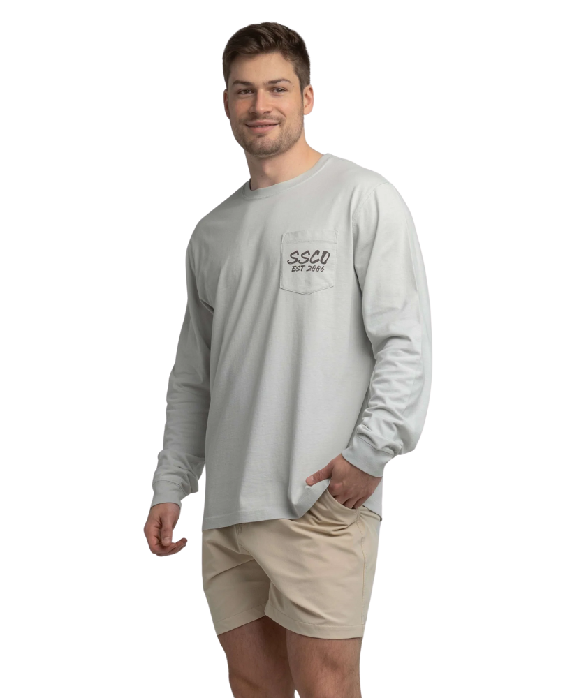 Man wearing a gray long-sleeve shirt with a logo on a white background