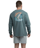Man wearing a long-sleeve shirt with a bass fish graphic on the back, standing against a white background.