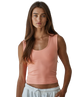 Woman wearing a pink tank top on a white background