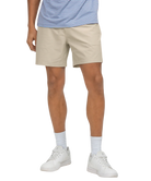 Person wearing beige shorts, a striped shirt, white socks, and white sneakers on a white background