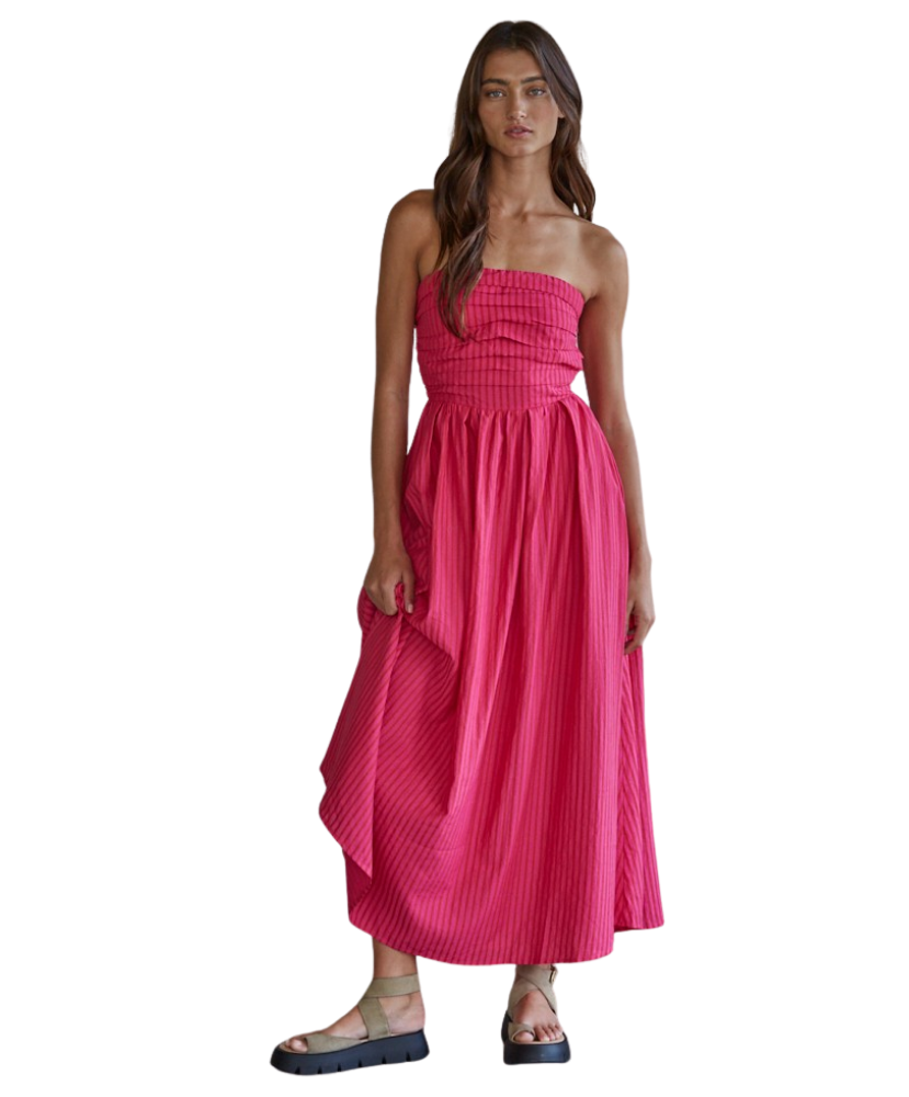 Woman wearing a pink strapless dress on a white background