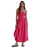 Woman wearing a pink strapless dress on a white background