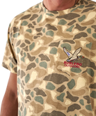 Camouflage t-shirt with a logo on a person wearing it