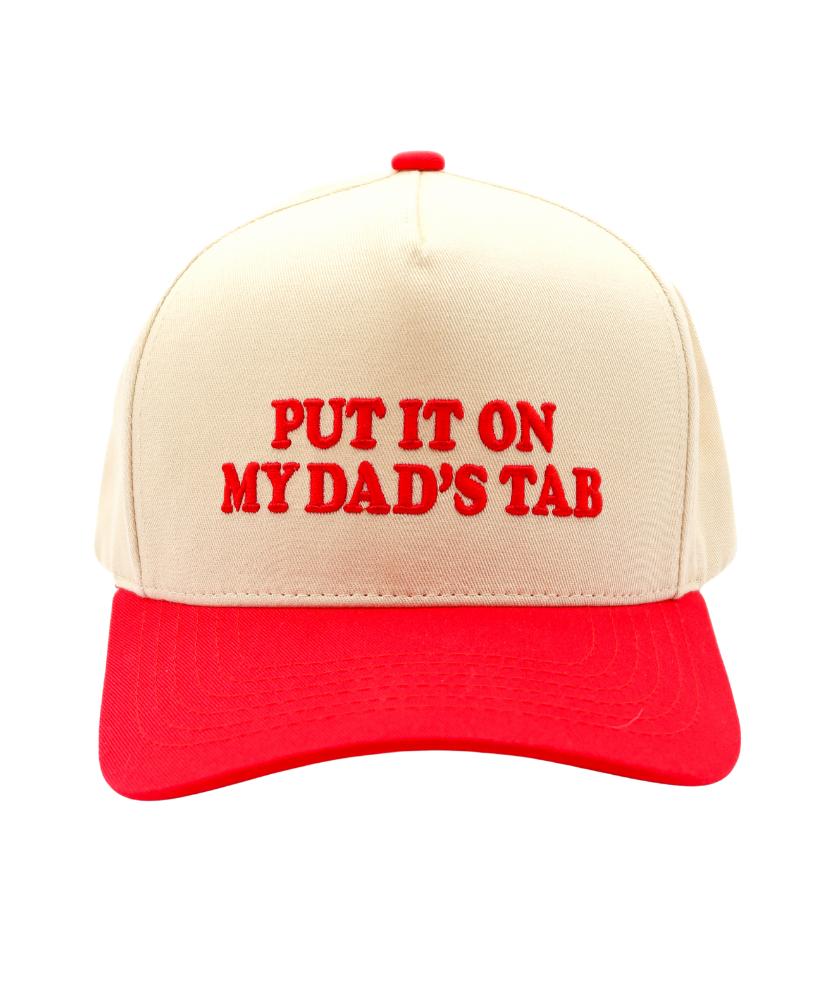 Beige and red cap with text 'PUT IT ON MY DAD'S TAB' on a white background